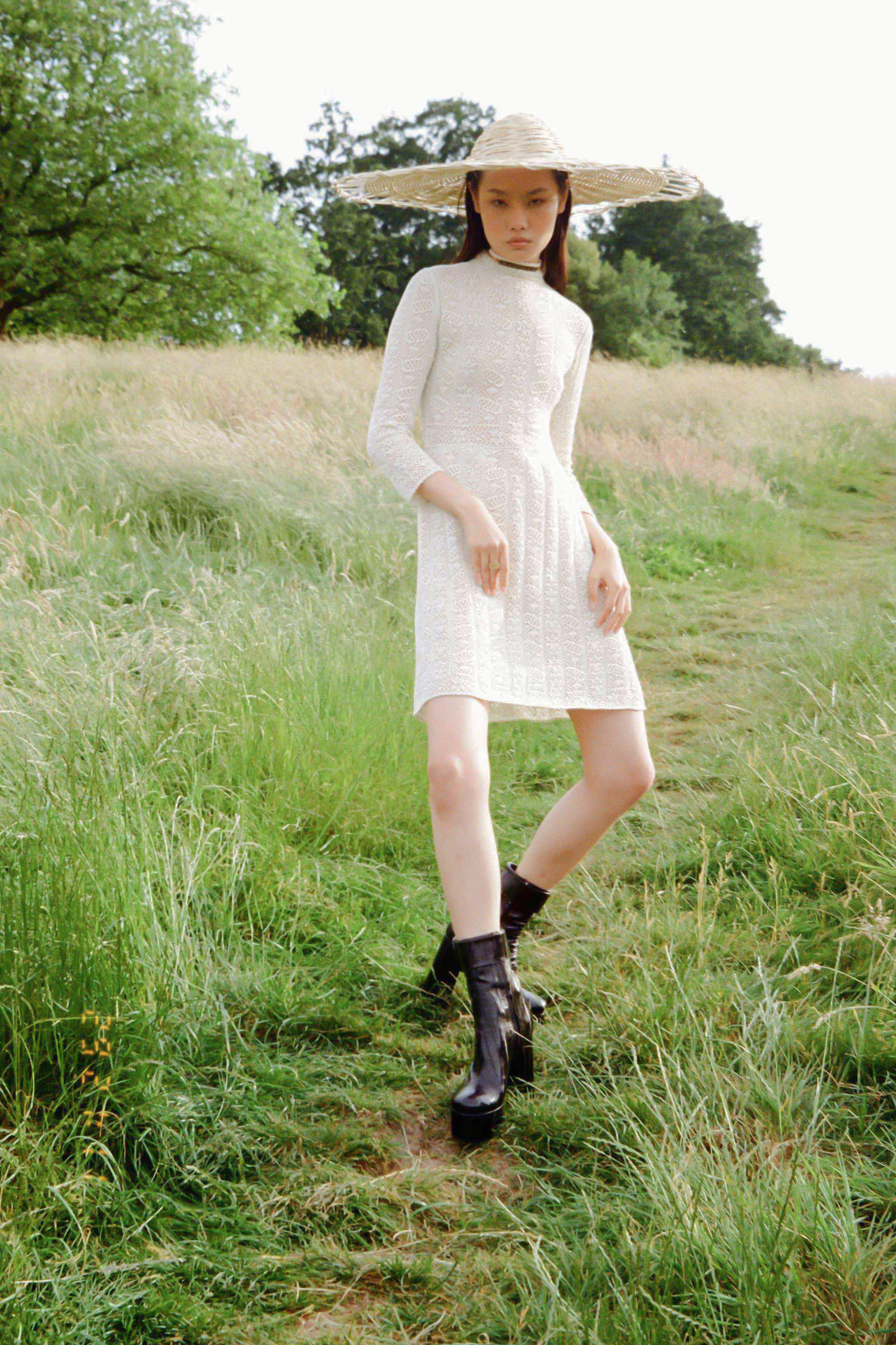 Model wearing a white dress for fashion editorial