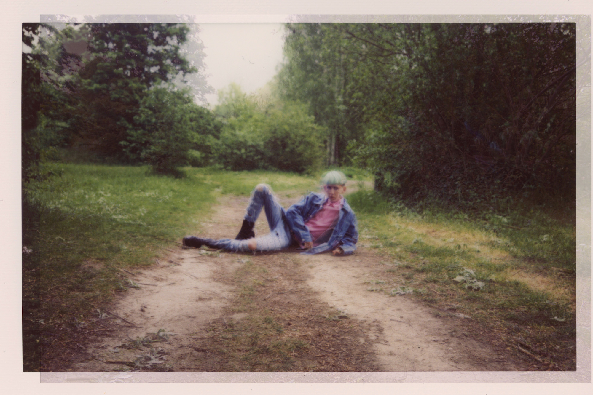 Outsider fashion editorial tree lying floor