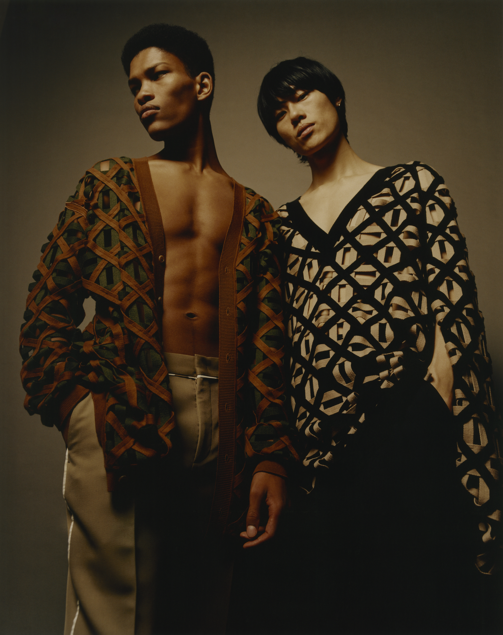 Fendi fashion editorial taken from our Spring issue two boys wearing fendi print poncho and one wearing fendi print cardigan