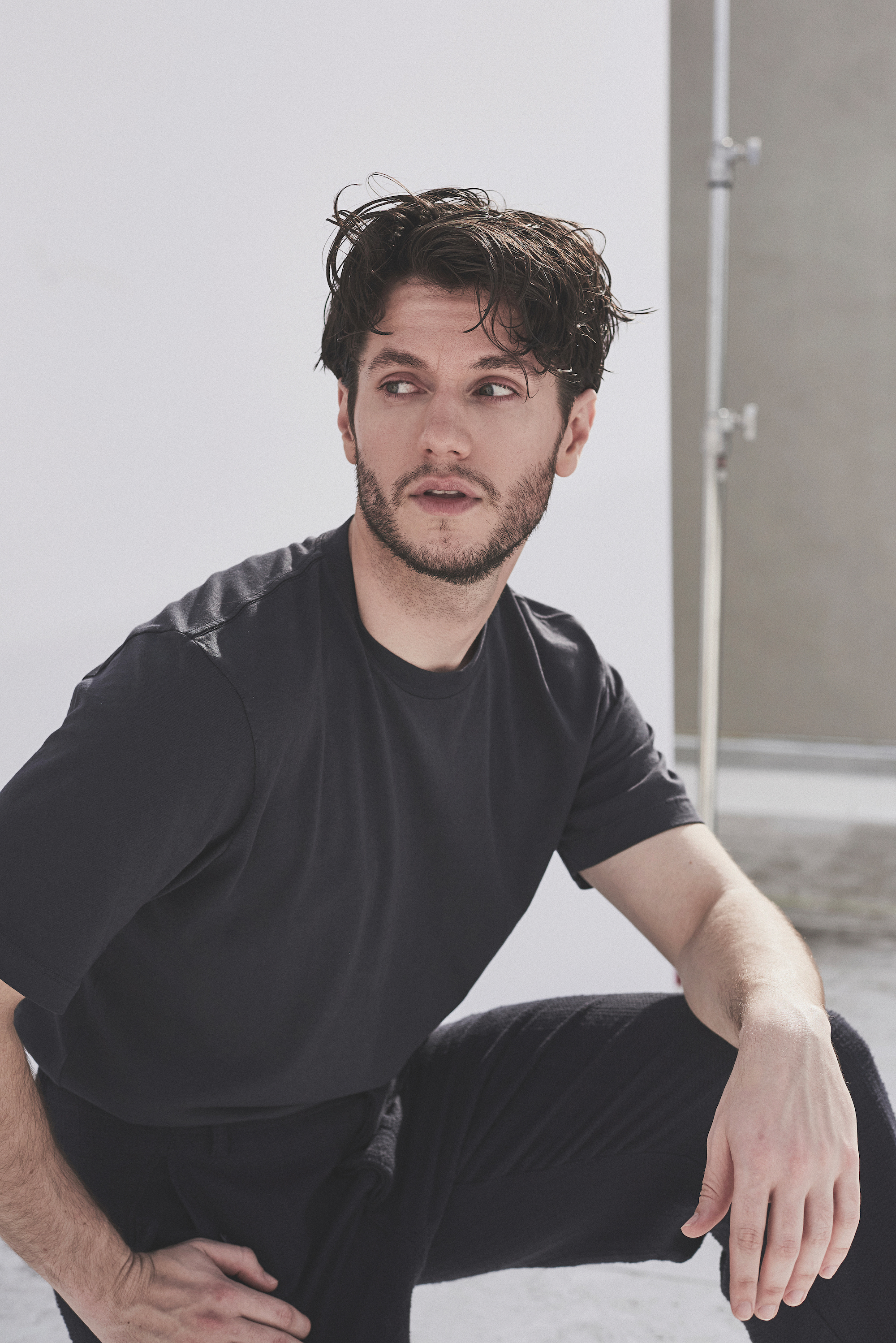 James Scully in plain black tshirt and jeans