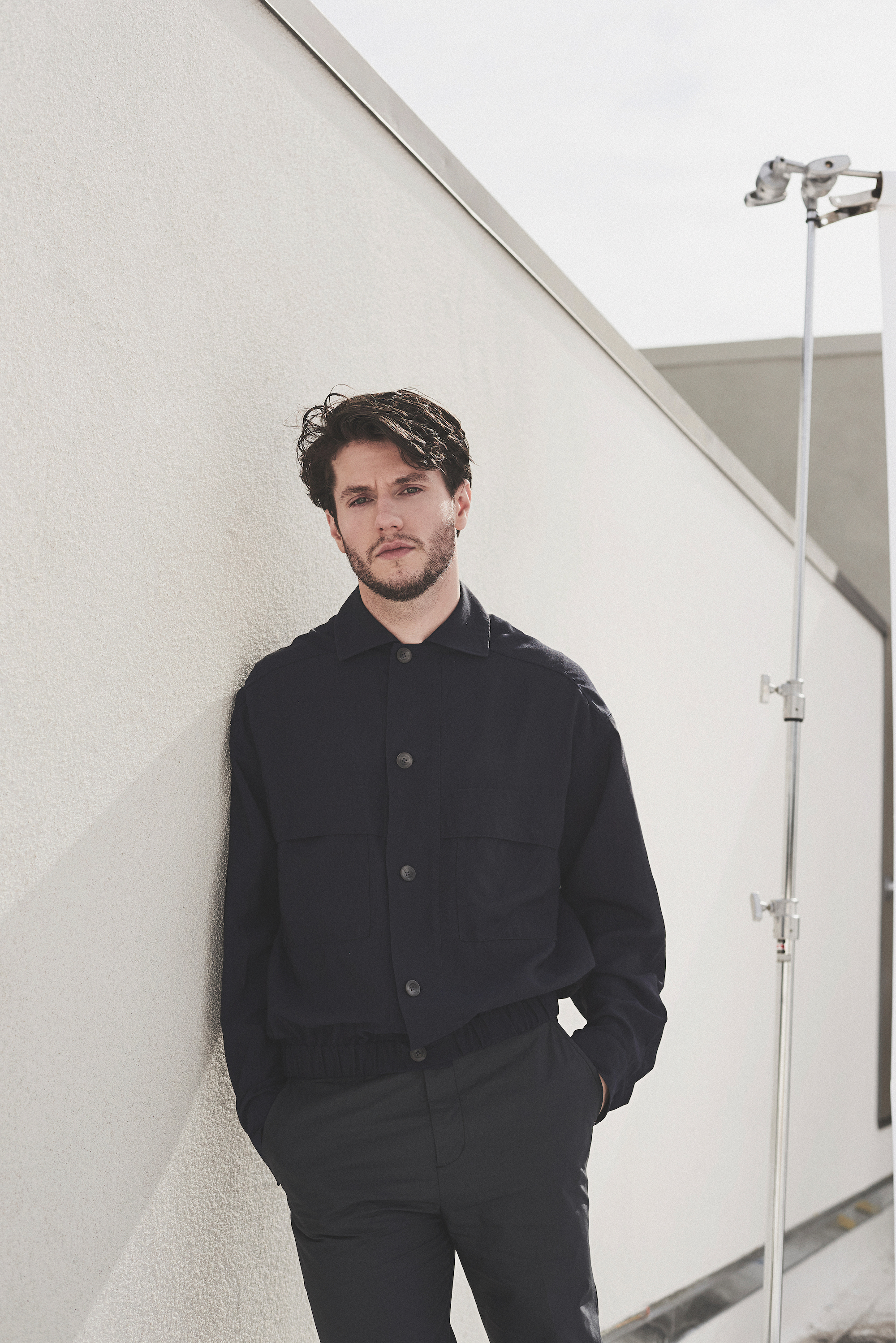 James Scully in black button shirt