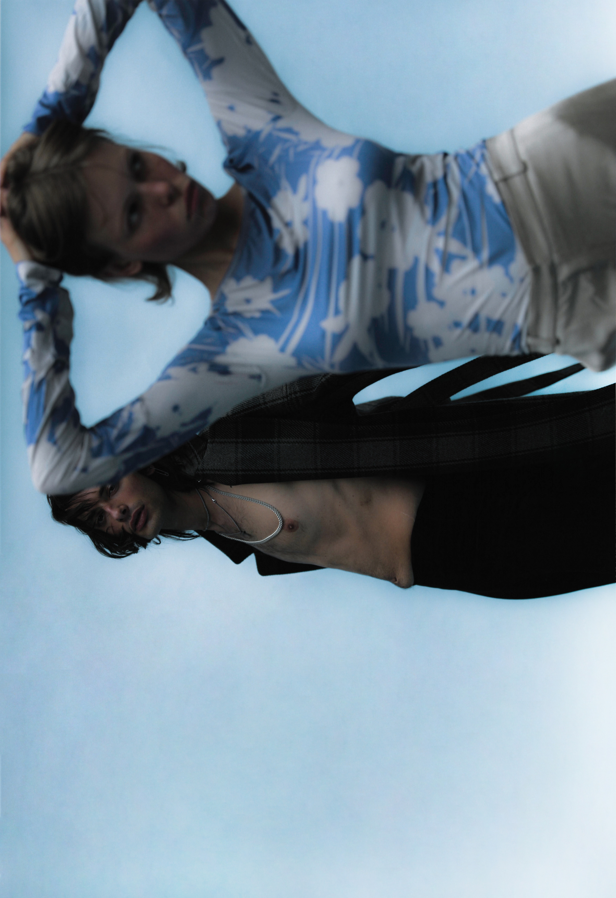 Two people shirtless wearing blue