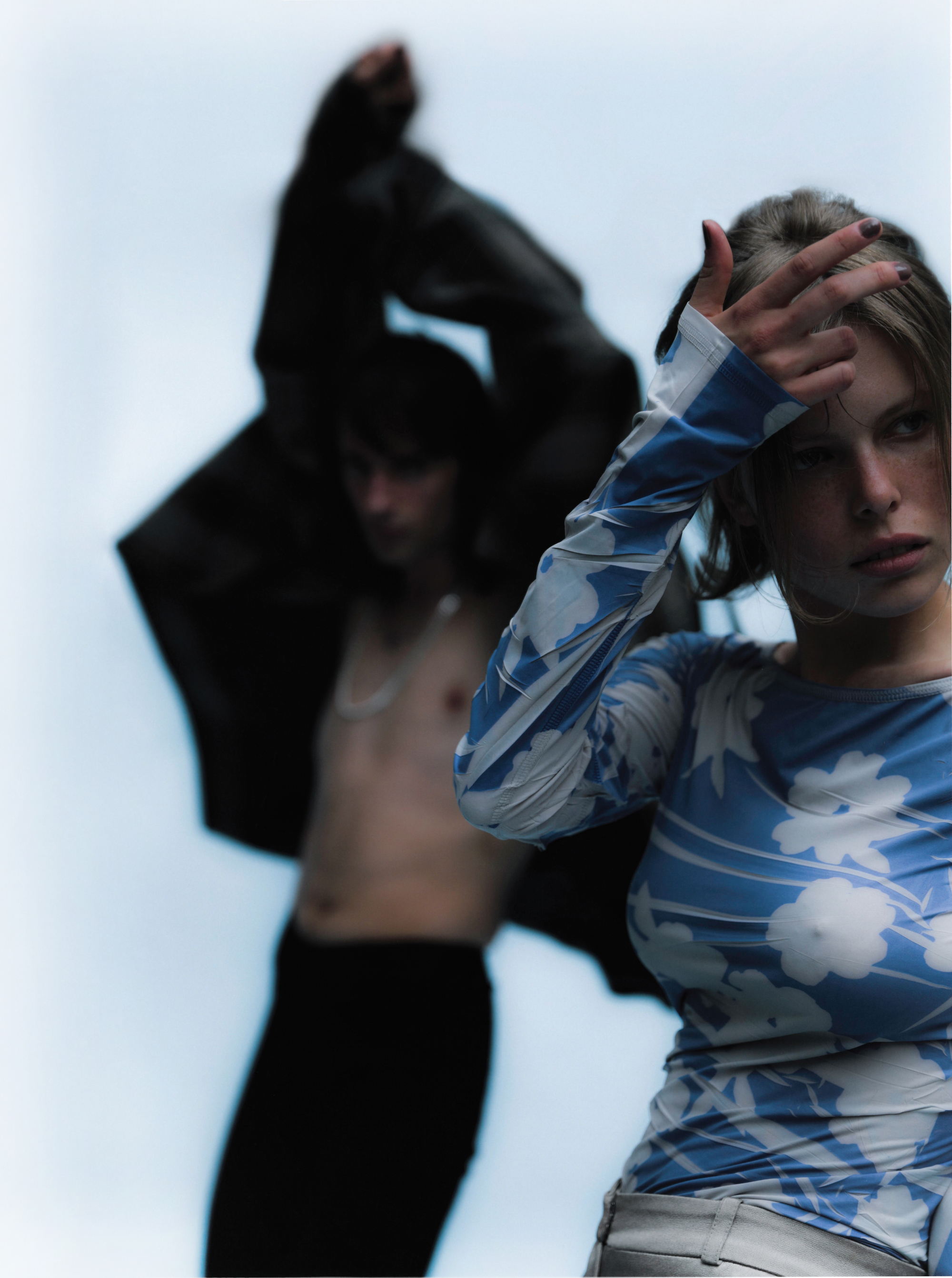 Two people shirtless wearing blue