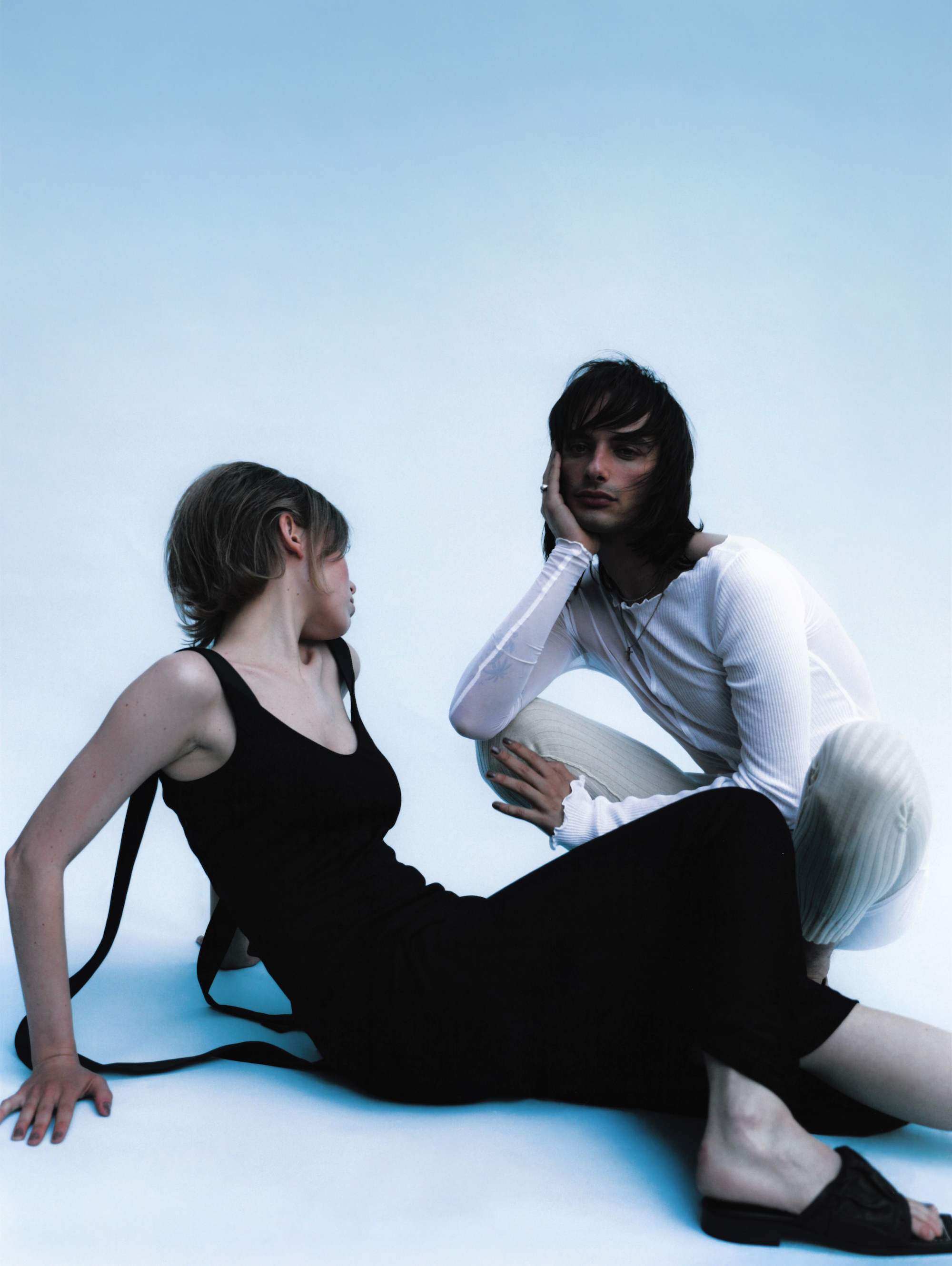Two girls white to and black jumpsuit