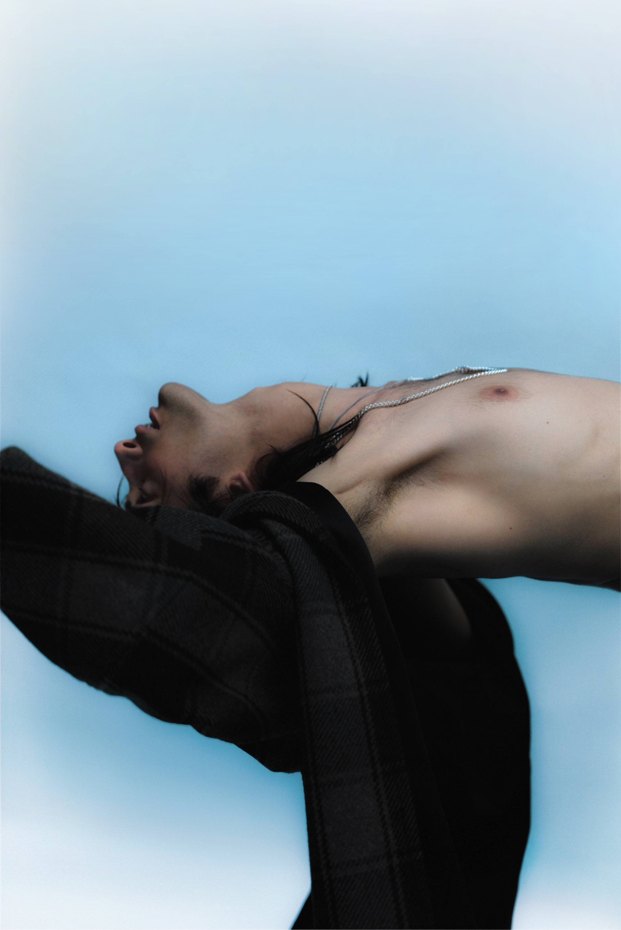 blue background shirtless