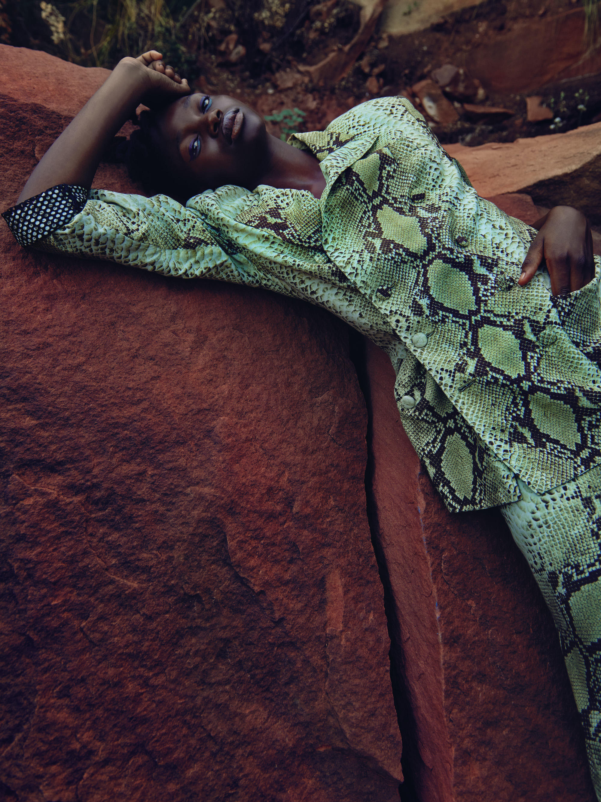 model wearing green snakeskin suit