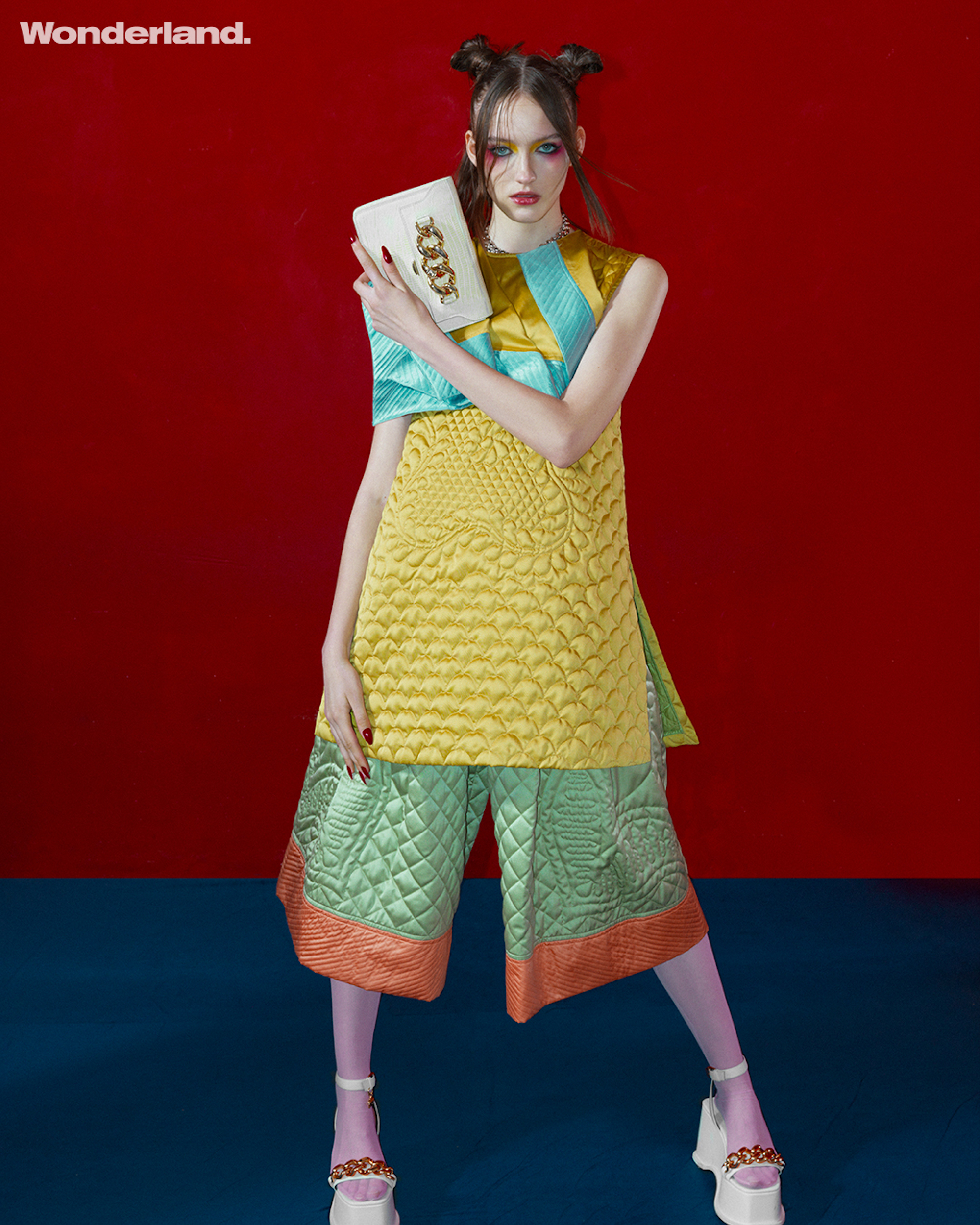 Fashion editorial red background yellow dress