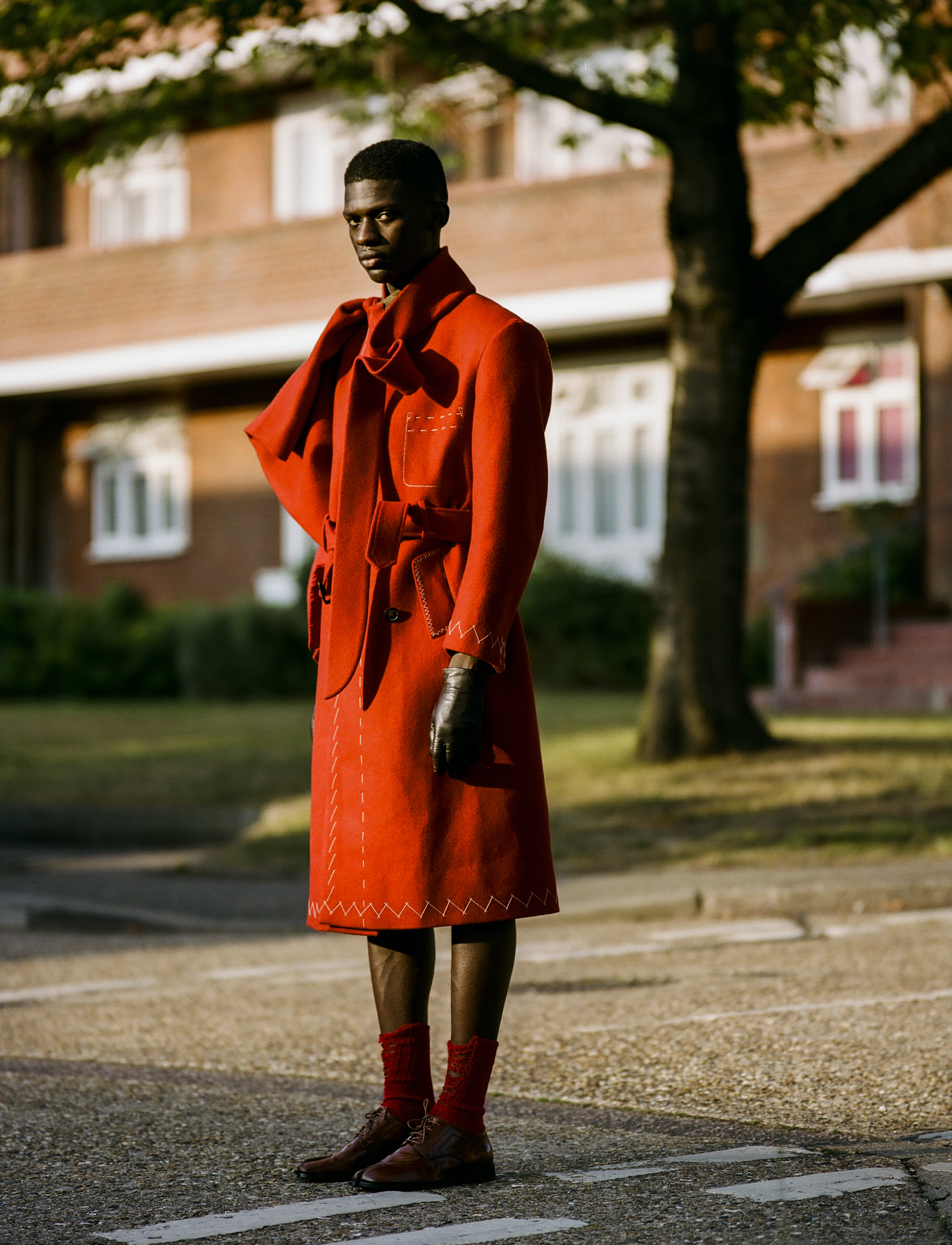 Model wearing long red coat